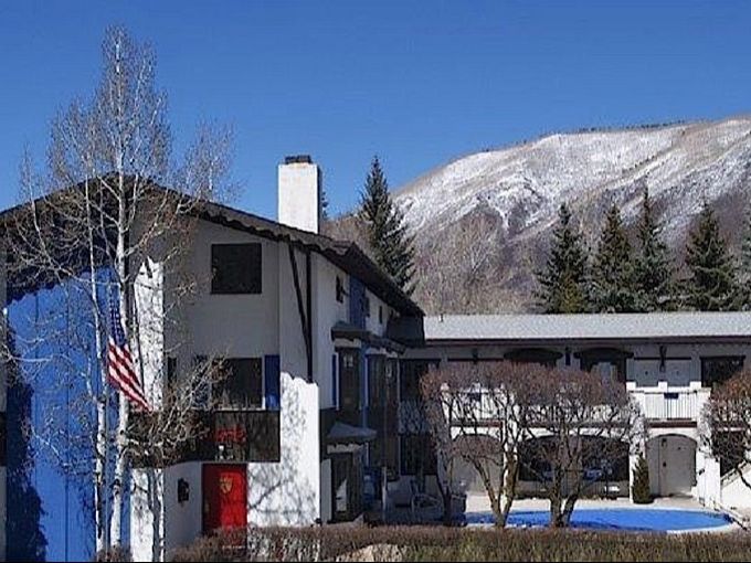 Hotel exterior with mountain in background 